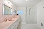The large beautiful master bath has a dual vanity and step in shower.